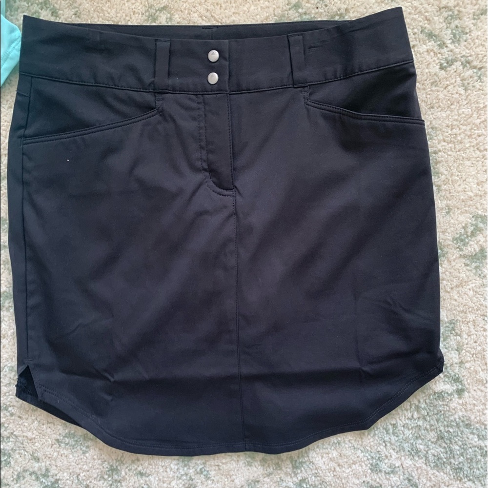 Two adidas size 2 women’s golf skirts